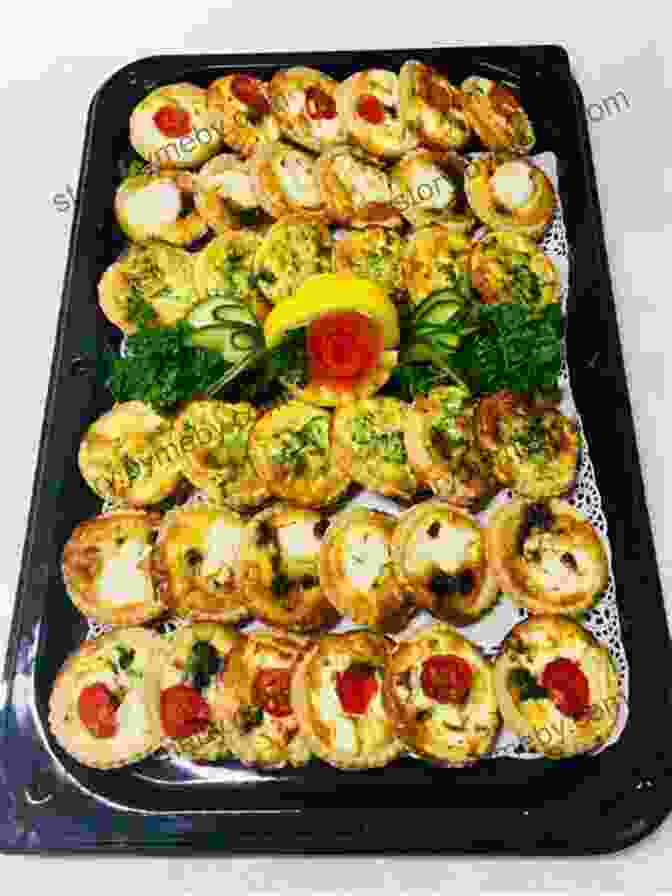 A Table Filled With An Assortment Of Colorful Appetizers, Including Mini Quiches, Bruschetta, Crab Rangoons, And Goat Cheese Crostini. Easy Crowd Pleaser Meals For Don T Look Up Cast: Tasty Recipes To Feed A Crowd