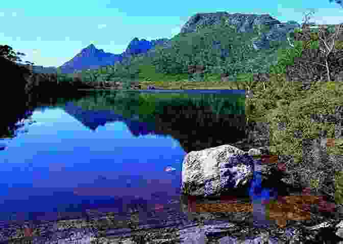 Cradle Mountain, Towering Majestically In Cradle Mountain Lake St Clair National Park. Lonely Planet Tasmania (Travel Guide)